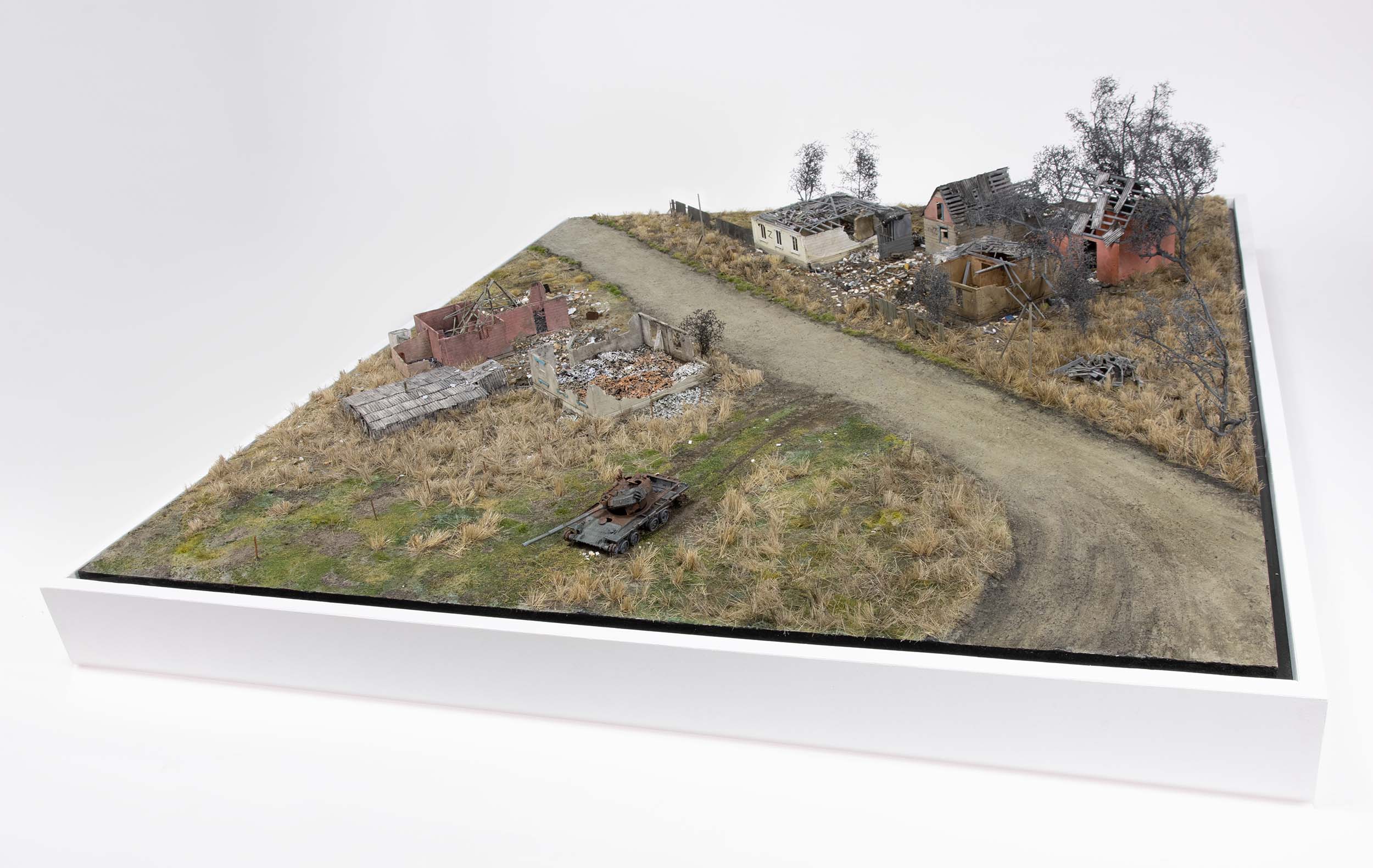 Model of a destroyed Russian tank near homes in the village of Kamianka, Ukraine, by artist Thomas Doyle for the Howard G. Buffett Foundation
