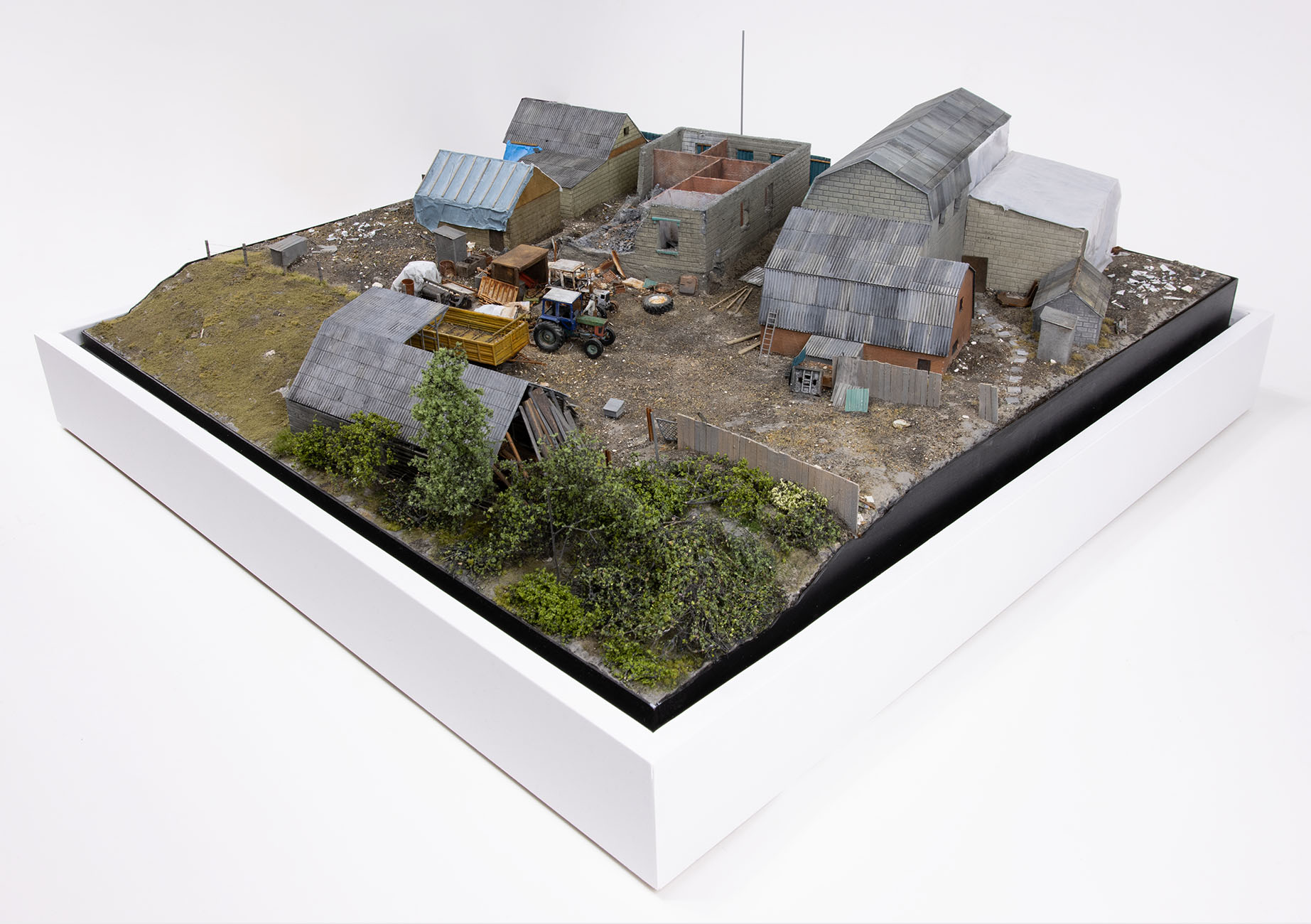 Model of damaged buildings in the village of Kamianka, Ukraine, by artist Thomas Doyle for the Howard G. Buffett Foundation