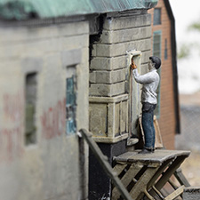 Thumbnail image of a model of damaged buildings in the village of Kamianka, Ukraine, by artist Thomas Doyle for the Howard G. Buffett Foundation