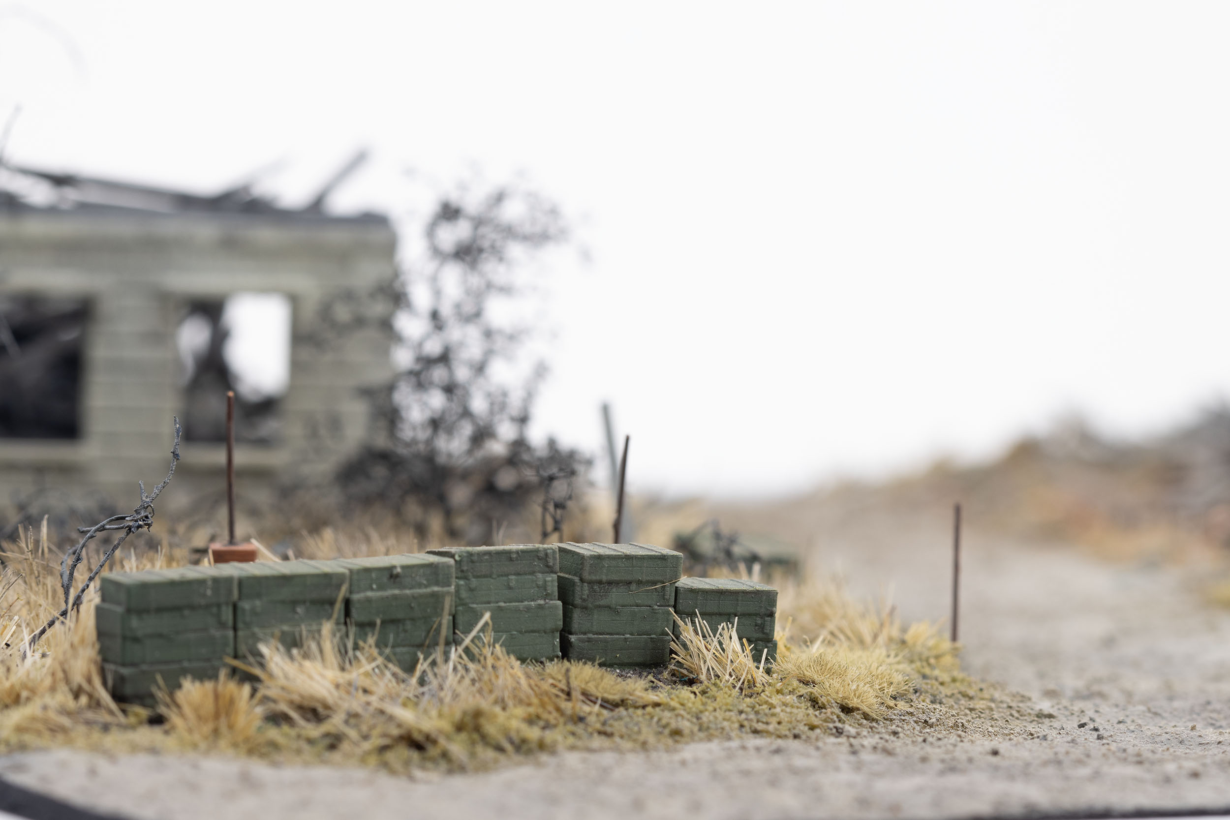 Model of ammunition crates stacked near destroyed homes in the village of Kamianka, Ukraine, by artist Thomas Doyle for the Howard G. Buffett Foundation