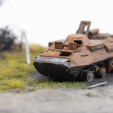 Thumbnail image of a model of a destroyed Russian BTR-90 in the village of Kamianka, Ukraine, by artist Thomas Doyle for the Howard G. Buffett Foundation